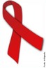 A fita vermelha é um símbolo da solidariedade pelas pessoas infectadas com o HIV e por aquelas que têm de viver com SIDA. <br /><br /> Palavras-chave: Sida, vírus, HIV.